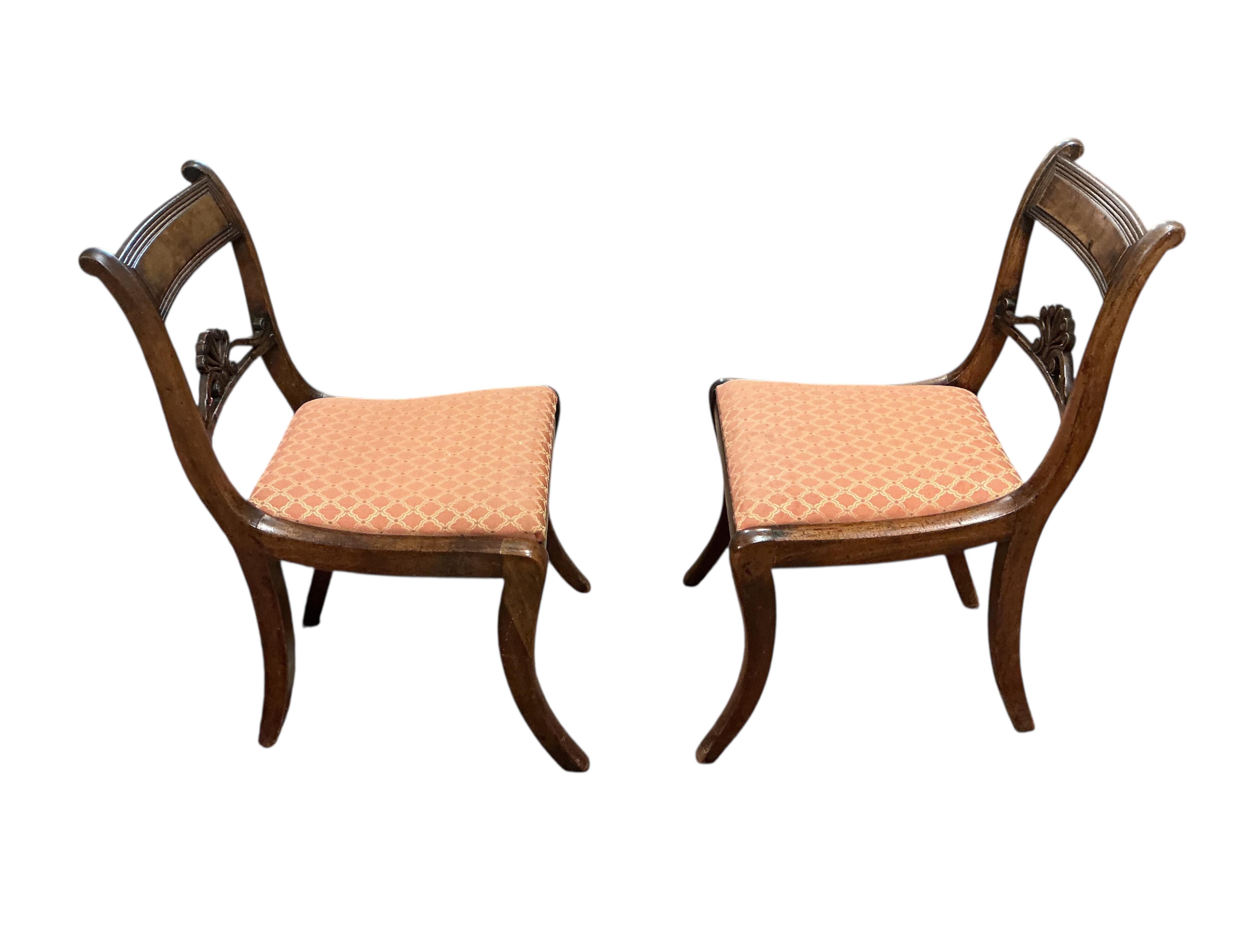 A set of eight Regency mahogany dining chairs, two with arms.